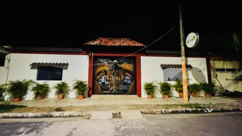 a building with a painting of a horse on it at HOTEL EMPRESARIAL Arcoiris de mi llano in Paz de Ariporo