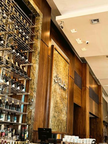 a wine tasting room with a large mural on the wall at Los Silos Hotel in Santa Fe