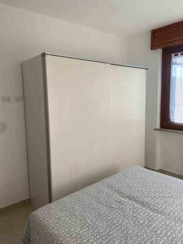 Ένα ή περισσότερα κρεβάτια σε δωμάτιο στο RESIDENCE Erminia