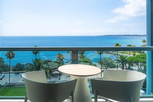 a view of the ocean from a hotel balcony at Marins Suites - Adults Only Hotel in Cala Millor