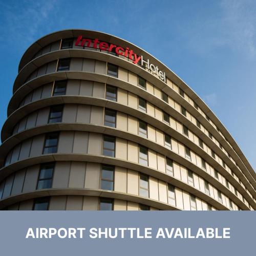 an apartment building with a sign on top of it at IntercityHotel Amsterdam Schiphol Airport in Hoofddorp