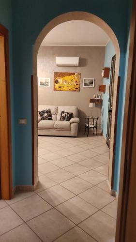 a living room with a couch and a table at Villa Grazia in Noto Marina