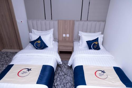 Katil atau katil-katil dalam bilik di فندق نجمة مارينا Marina Star Hotel