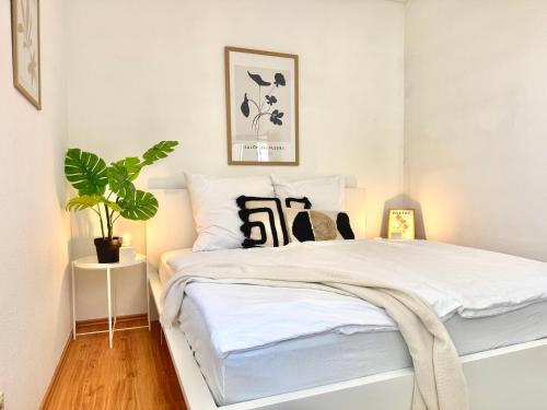 Postel nebo postele na pokoji v ubytování Stylisches Loft-Apartment in der Stadtmitte - PAUL -