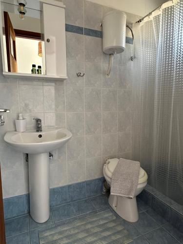 a bathroom with a sink and a toilet at EL.DO.SO in Gavrio