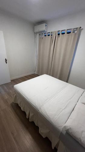 Postel nebo postele na pokoji v ubytování Apartamento à 100 metros do mar - Meia Praia