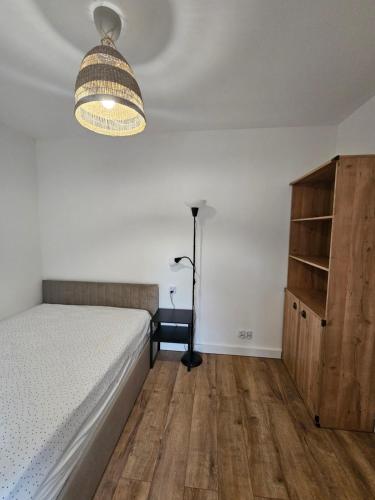 En eller flere senge i et værelse på Apartament na Jasnej