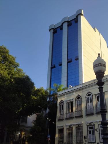 a tall building with a street light in front of it at Diamond Hotel in Rio de Janeiro