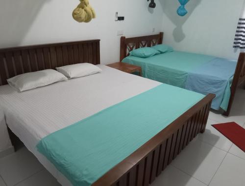 Postel nebo postele na pokoji v ubytování Mango Villa 703