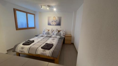 Postel nebo postele na pokoji v ubytování Ferienwohnung Slavica Dorfstrasse 94 Randa