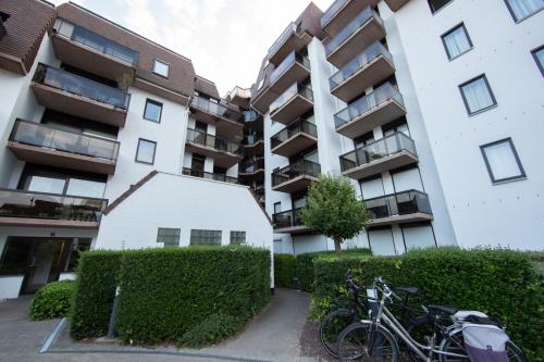 a bike parked in front of an apartment building at Promenade J 0402 in Koksijde