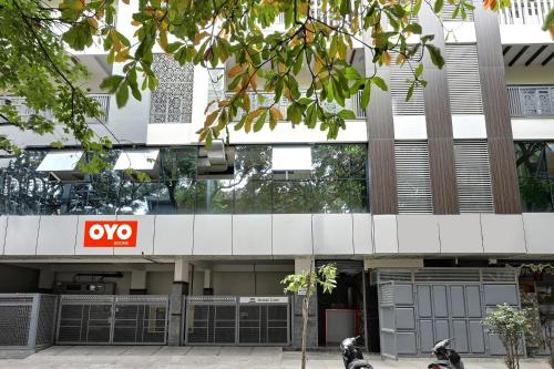 an office building with a xo sign in front of it at Hotel O Mr Guestline in Bengaluru