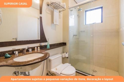 a bathroom with a sink and a shower at Century Park by My Way in Porto Alegre