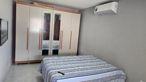 Postel nebo postele na pokoji v ubytování Casa Temporada Ondas do Mar