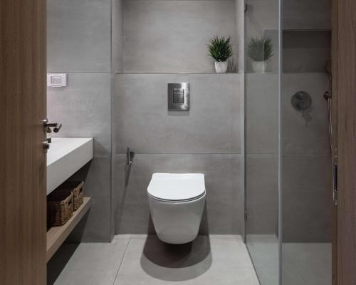 a bathroom with a toilet and a sink at Tayo Studios & Apartments in Bat Yam