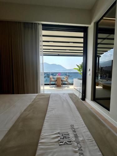 a hotel room with a view of the ocean at Rea Boutique Hotel in Himare