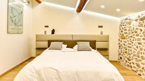 Ein Bett oder Betten in einem Zimmer der Unterkunft Le Palais Aubernon