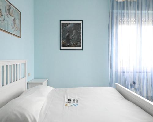 Postel nebo postele na pokoji v ubytování M446 - Marcelli, trilocale in residence con piscina