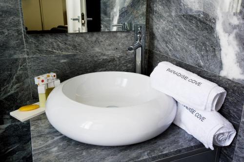 a bathroom with a sink and towels on a counter at Luxury Cyprus Villa Aqua Villa Private Pool Sea View 2 Bdr Paphos in Paphos