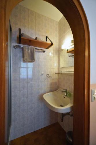 a bathroom with a sink and a mirror at Pension Sonnenheim in Gmünd in Kärnten