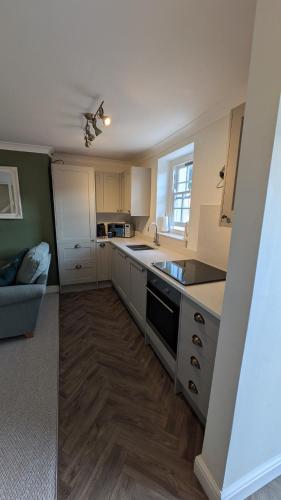 a kitchen with a sink and a counter top at Hidden Gem on the Outskirts of Bristol in Keynsham