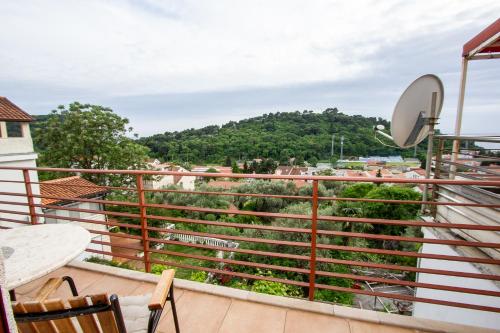 a balcony with a view of a mountain at Guest House Jedro in Petrovac na Moru