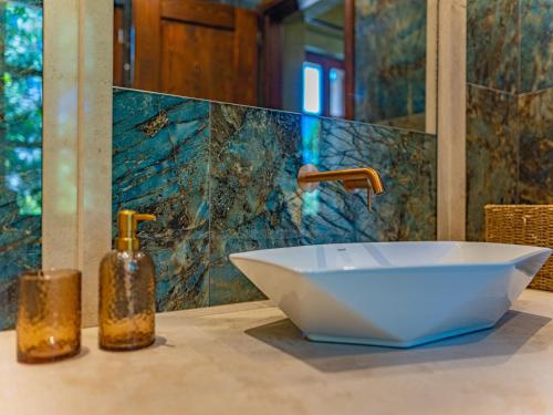 a white sink sitting on a counter in a bathroom at Fabrizio del Carretto in Rhodes Town