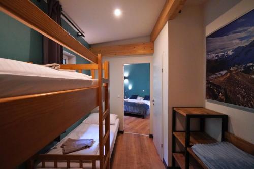 a room with two bunk beds and a bedroom at Pension Sonnenheim in Gmünd in Kärnten