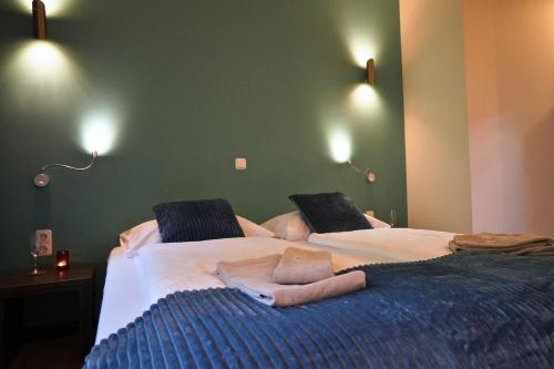 a bedroom with two beds with towels on them at Pension Sonnenheim in Gmünd in Kärnten