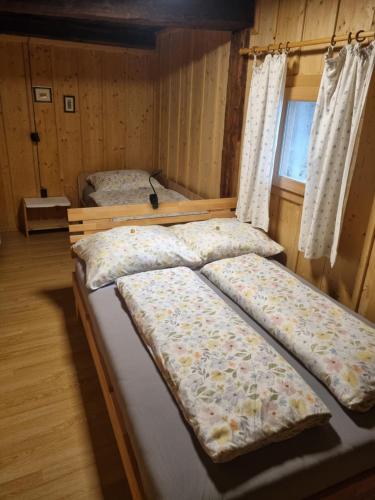 Katil atau katil-katil dalam bilik di Ferienchalet Murau Blick