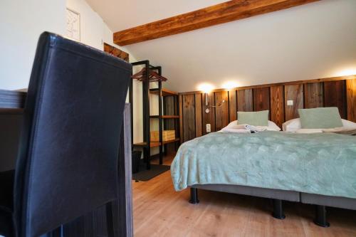 a bedroom with a bed and a tv in it at Pension Sonnenheim in Gmünd in Kärnten