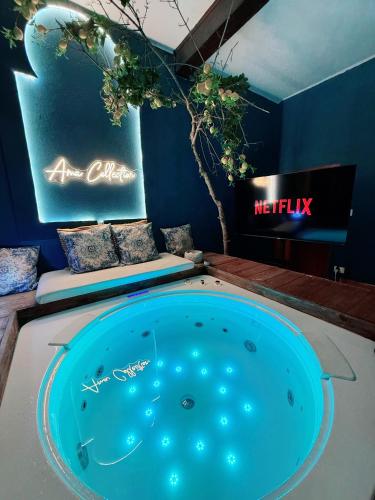a hot tub in a room with two signs at AMA Esclusive SPA Ariosto in Ferrara