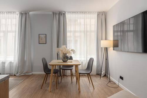 a dining room with a table and chairs at P6-A Riga Old Town Apartments in Rīga