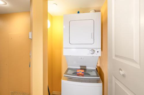 a small bathroom with a watermill on top of a toilet at The Grandview at Las Vegas in Las Vegas