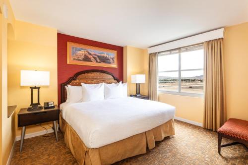 a hotel room with a large bed and a window at The Grandview at Las Vegas in Las Vegas