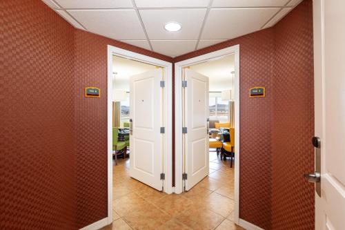an open door in an office hallway with red walls at The Grandview at Las Vegas in Las Vegas