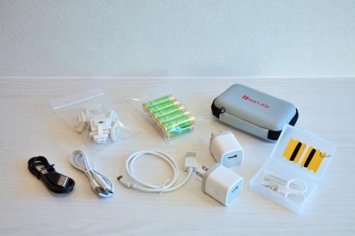 a nintendo wii with a charger and other electronic devices at TOMALCO INN NAKANO 2 3F Flat 2 Bath 13 min to Shinjuku from Honancho in Tokyo