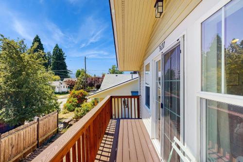a balcony with a view of a house at New Portland Neighborhood Studio in Portland