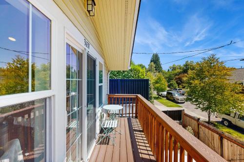 a balcony of a house with a table and chairs at New Portland Neighborhood Studio in Portland
