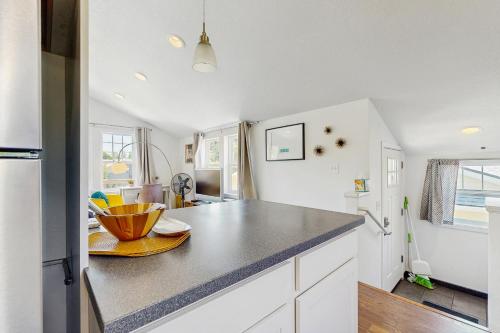 a kitchen with white cabinets and a counter top at New Portland Neighborhood Studio in Portland