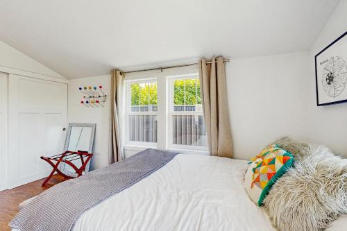 a bedroom with a bed and a window at New Portland Neighborhood Studio in Portland