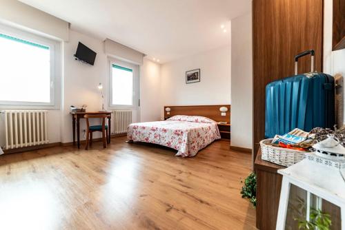 Katil atau katil-katil dalam bilik di Hotel National