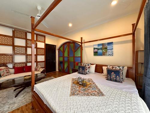 a bedroom with a bed with a tray on it at Silver Woods- A Boutique Cottage in Srinagar