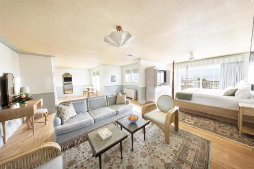 a living room with a couch and a bed at The Sanderling in Duck