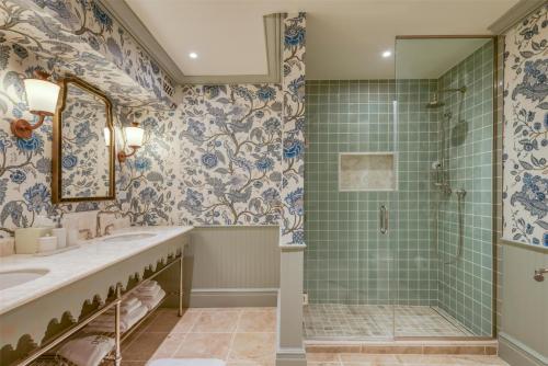 a bathroom with a shower and a sink at The Sanderling in Duck