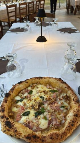 a pizza sitting on top of a table at Agriturismo Crilù in Milazzo