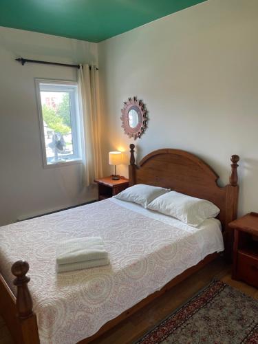 Ένα ή περισσότερα κρεβάτια σε δωμάτιο στο Auberge du Wagon