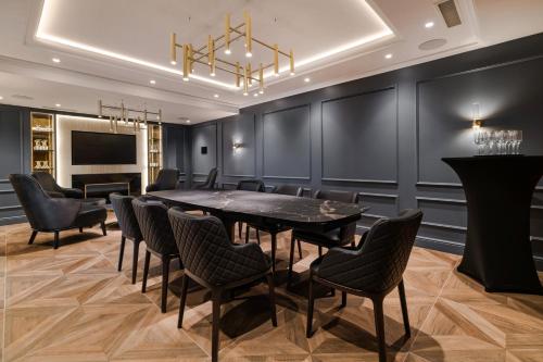 a conference room with a table and chairs at Wings Plaza in Kraków