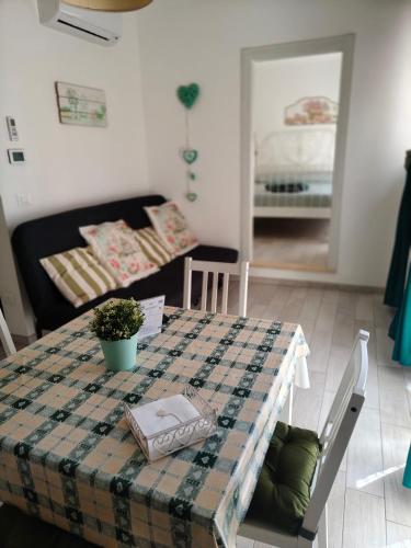 a table with a plaid table cloth on it in a room at Romantico Rifugio in Guardiagrele