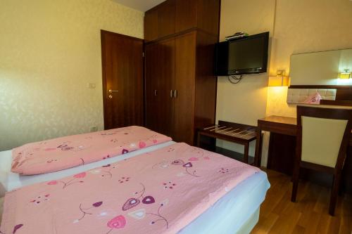 Ένα ή περισσότερα κρεβάτια σε δωμάτιο στο Vila Silva Marija Apartments